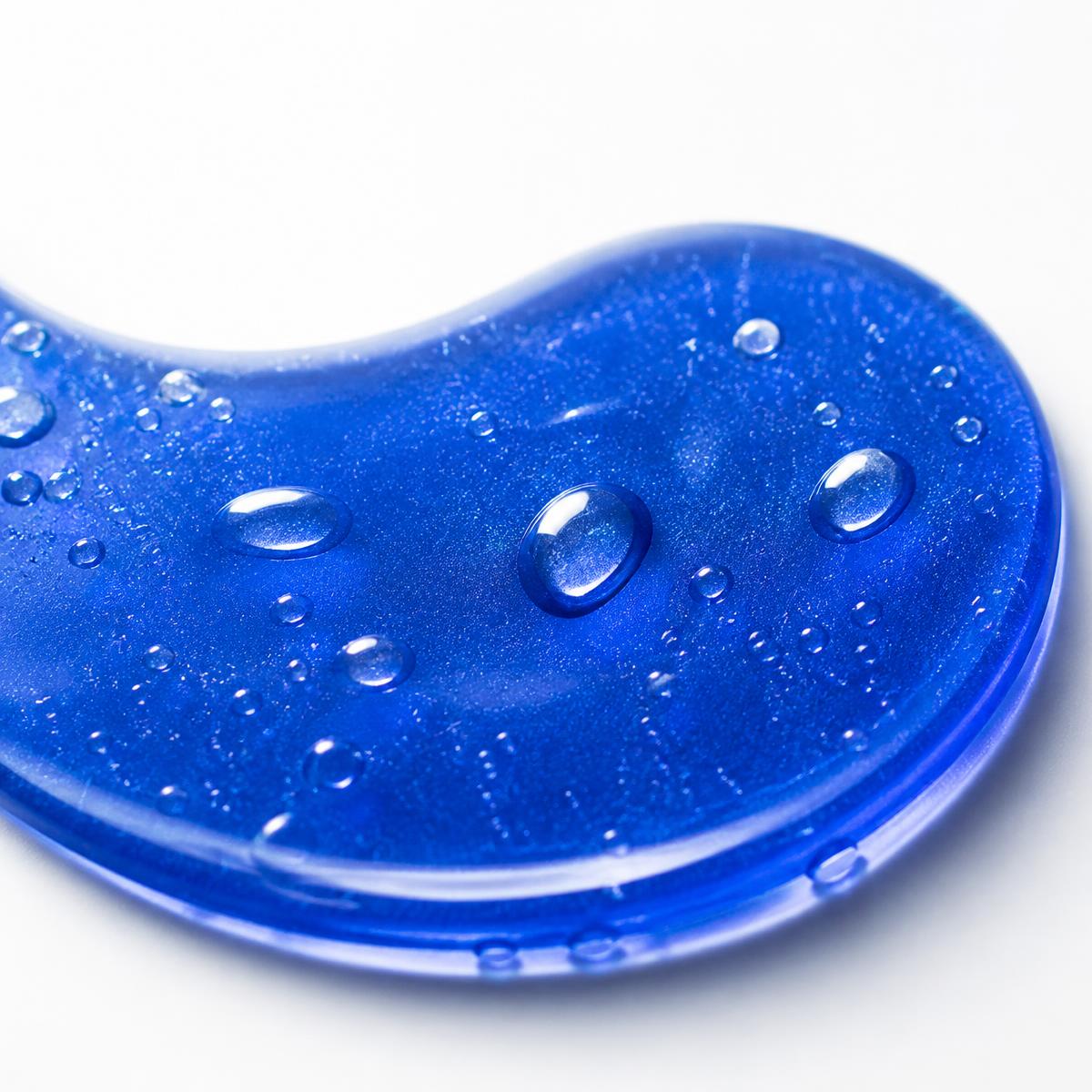 Two fresh blue gel eye patches showing their wet surface before use